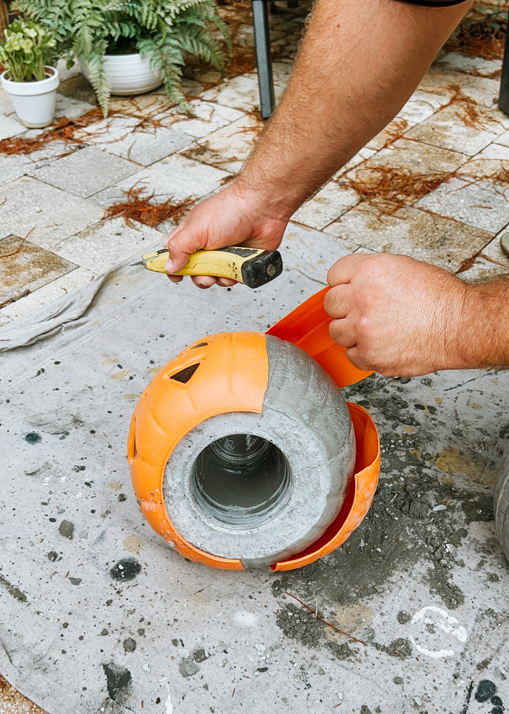 Cut the plastic so that you can remove it from the cement