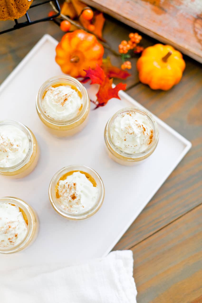 The best No Bake Pumpkin Cheesecake combines some of the favorite flavors of fall! Serve it in jars for an easy individual serving! Perfect for desserts, parties, fall events and more. 