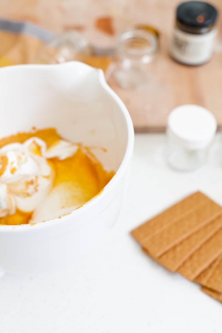 The best No Bake Pumpkin Cheesecake combines some of our favorite flavors of fall in a dish that's so simple to whip up, rich and creamy! Serve it in jars for an easy individual sharing.